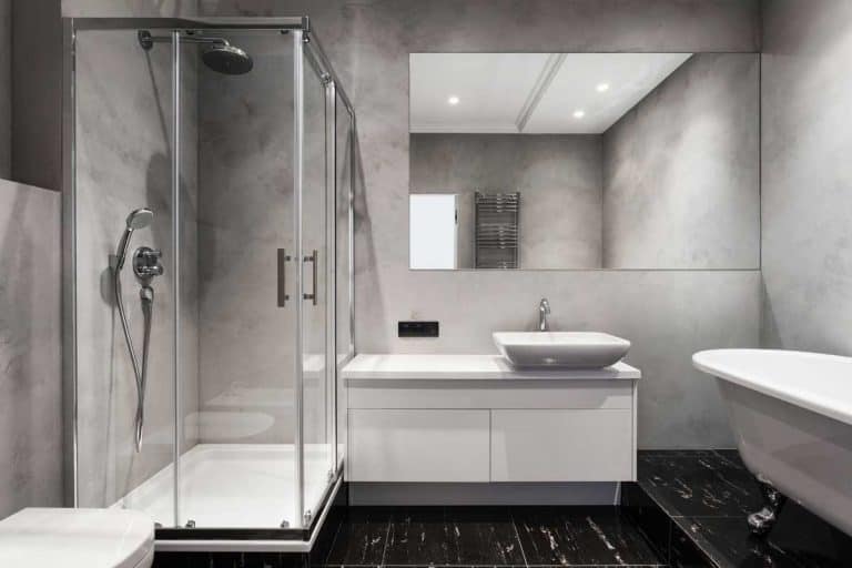 Modern interior of new bathroom with glass shower cabin, 5 Types of Shower Doors [Which Is Best for Your Needs?]