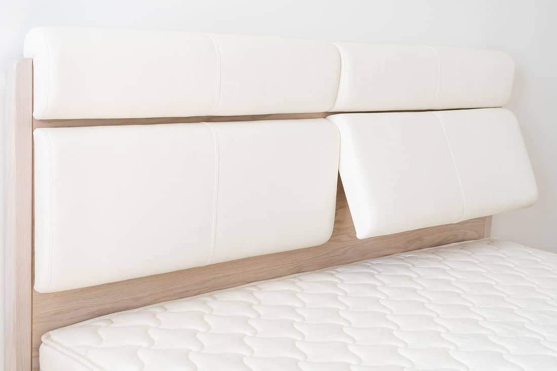 Oak wood bed with white leather adjustable bed headboard