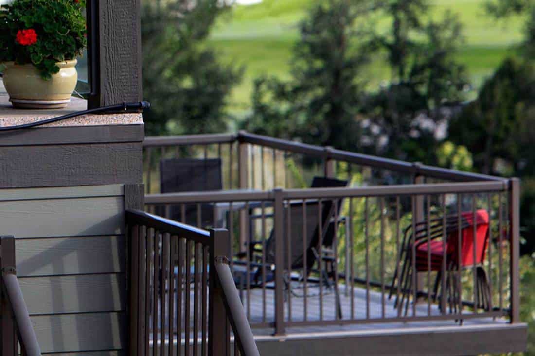 Residential iron railings of a front porch, 5 Best Materials For Porch Railings and Banisters