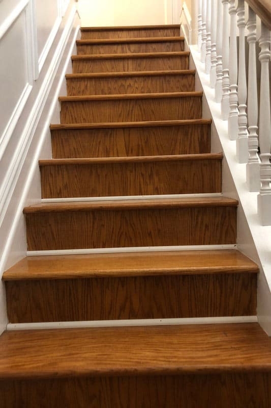 Shiny wooden stairs inside a two story house