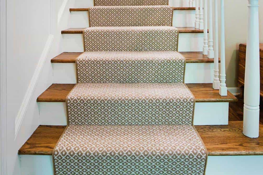 Showcase interior design of a first floor staircase and stairwell of a luxury home, Here's How Long It Takes To Carpet A Flight Of Stairs