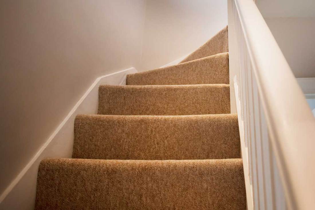 Stairs with stair carpet inside a newly modernized house, Should Landing Carpet Match The Bedrooms' Carpet?