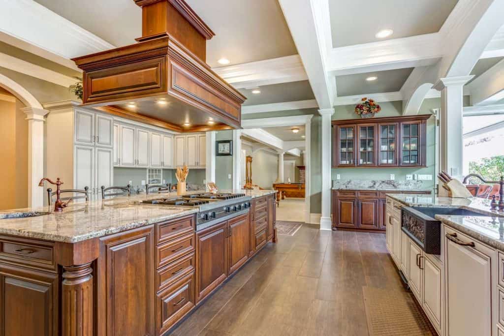 Stunning kitchen room design with large bar style island and coffered ceiling