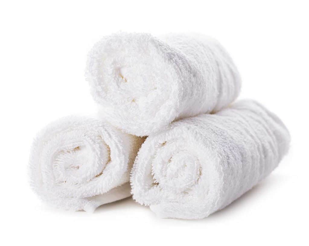 Three rolls of white towels
