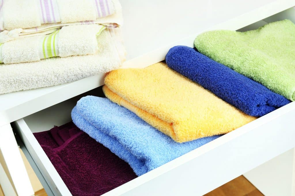 Colored towels in open drawer