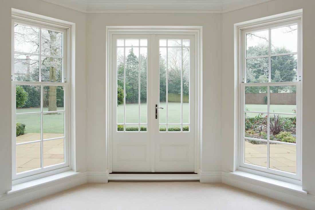 White bay windows and french doors, Do French Doors Open In Or Out? [Here are your options]