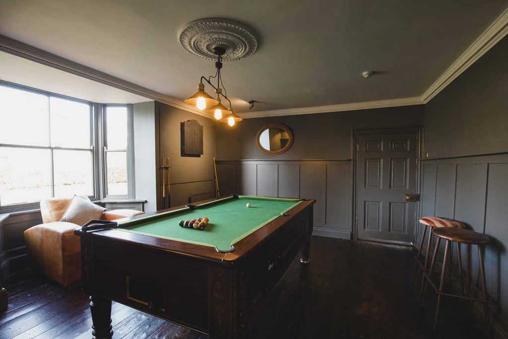 Wide angle view of an interior of a games room in a house