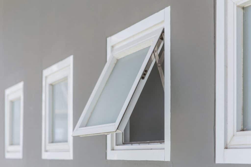 An open aluminum push window of a modern home