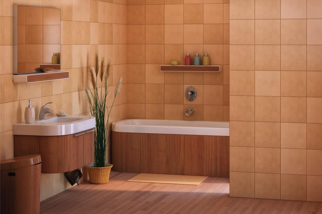 Bathroom with earth colored tiles and wooden accents