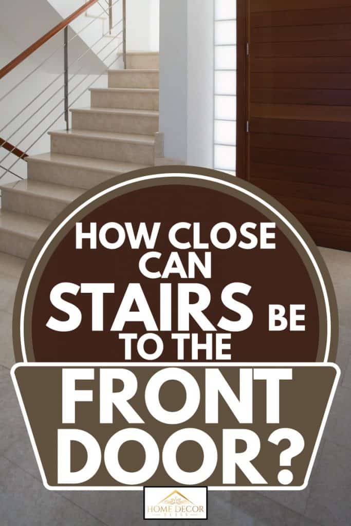 Interior staircase beside a wooden entrance door to a house, How Close Can Stairs Be To The Front Door?