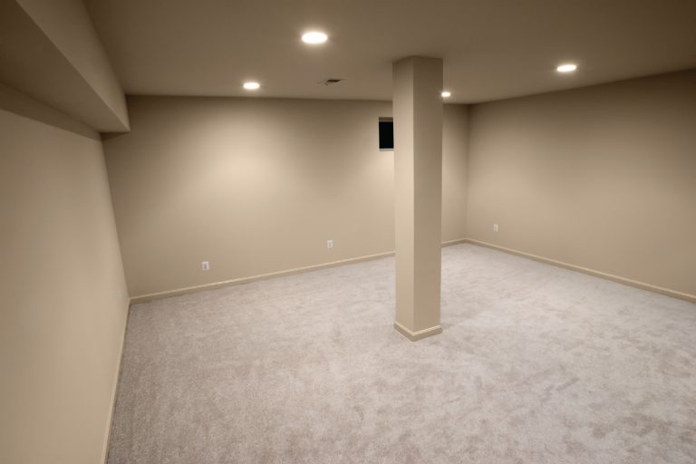 newly constructed basement empty interior with single column in the center, How To Decorate A Column In the Middle Of A Room? (17 Ideas)