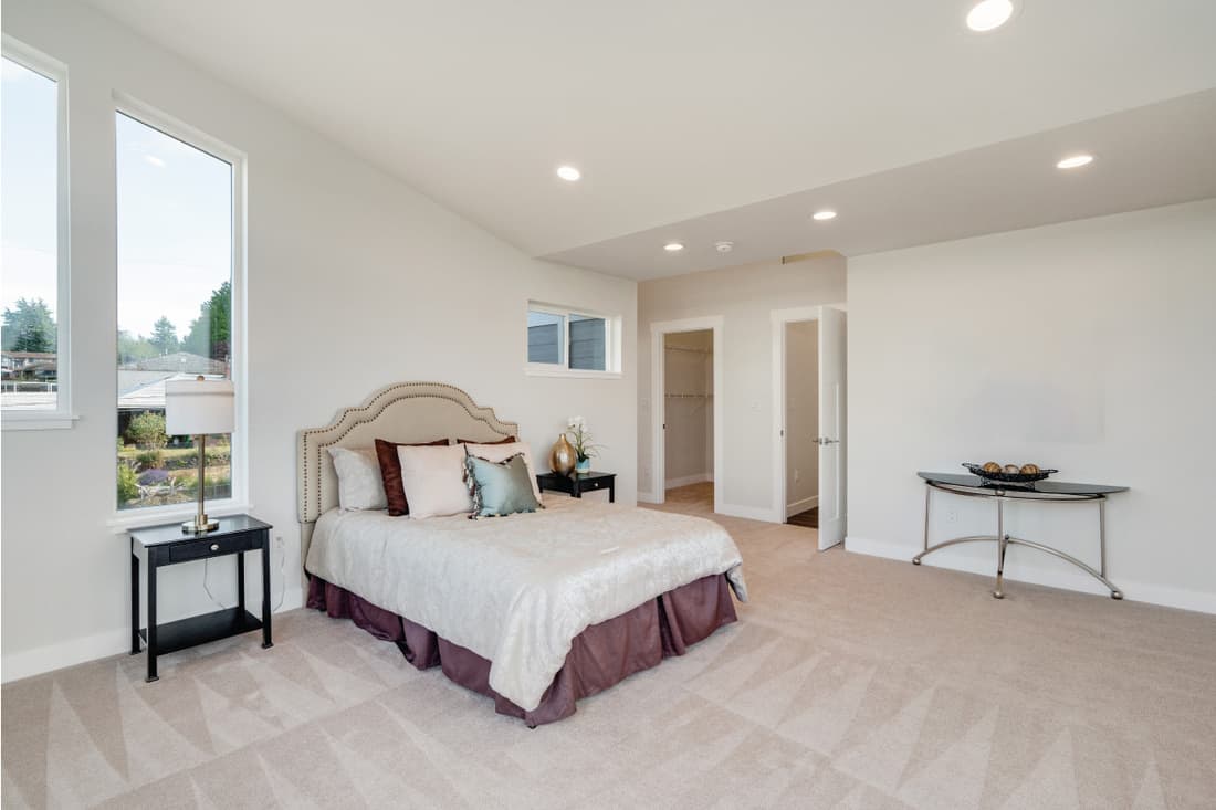 Sloped ceiling master bedroom with big windows, What's The Standard Ceiling Height? [Answers by House Floor]