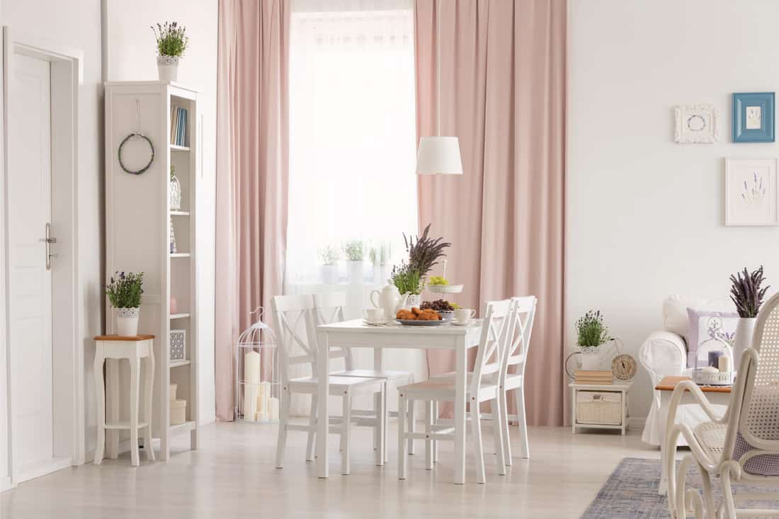 White flat interior with big windows and large curtains
