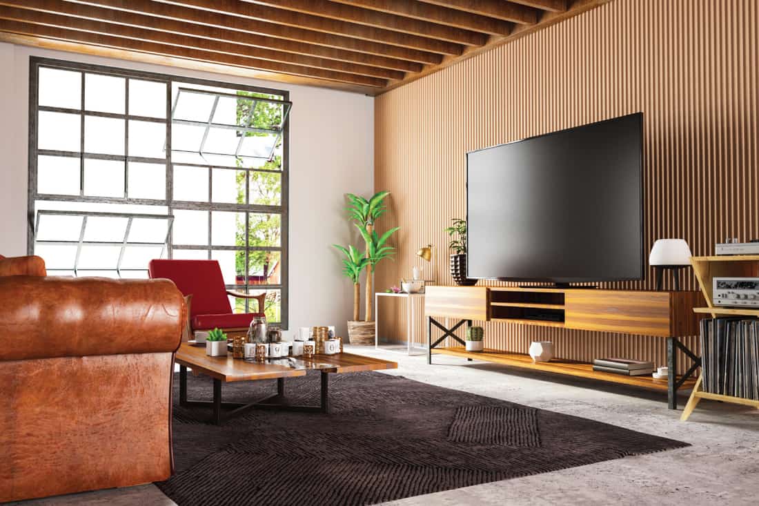 wooden accented wall panels in a living water with big TV and sofa, 25 Wonderful Wood Paneling Ideas for Your Walls
