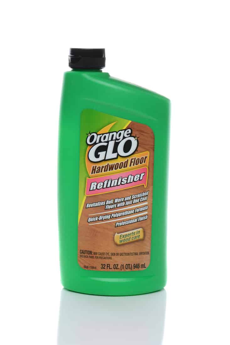 A bottle of Orange Glo Hardwood Floor Refinisher. Manuffactured by Church and Dwight Co, in Ewing, New Jersey.