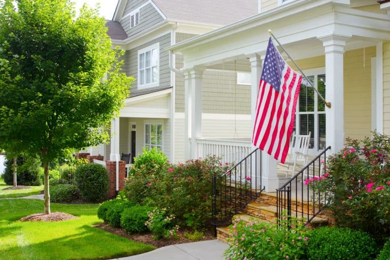 An American Flag hanging in a bungalow styled front porch, Which Side Of Porch To Hang American Flag?