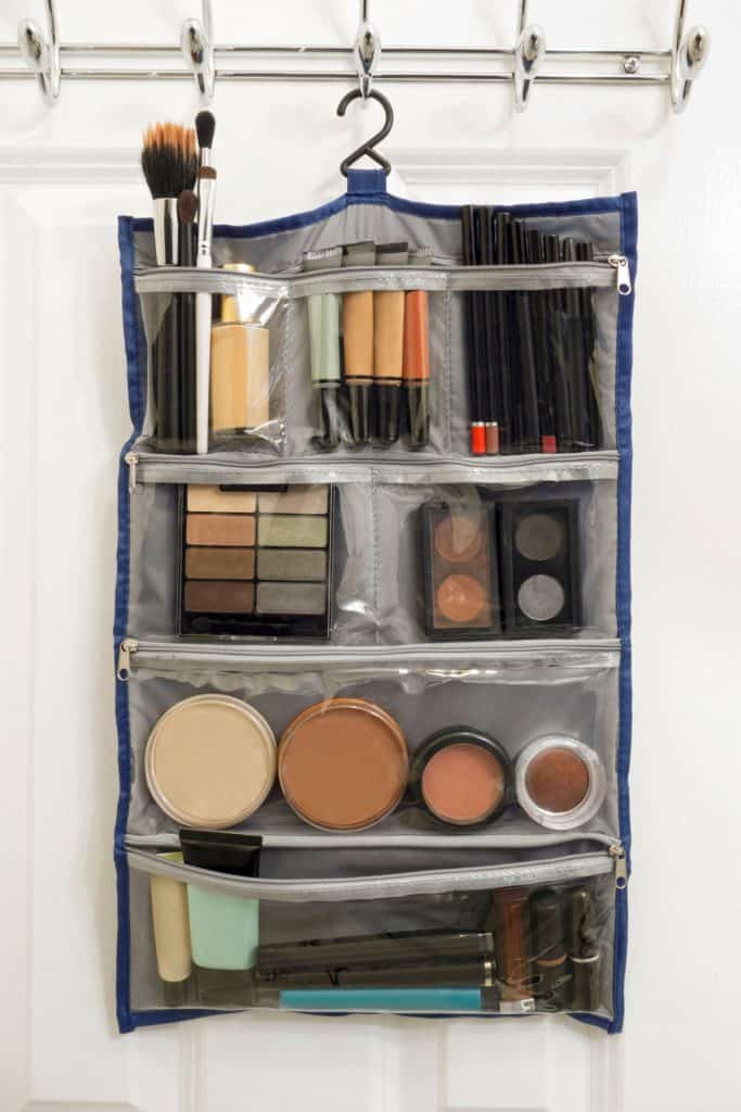 A makeup kit filled with makeup materials, foundations, lipsticks and eyeliners