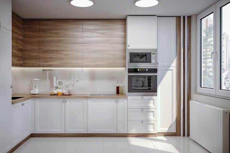 A modern kitchen with wooden paneling and white painted lower cabinet section, A modern kitchen with wooden paneling and white painted lower cabinet section
