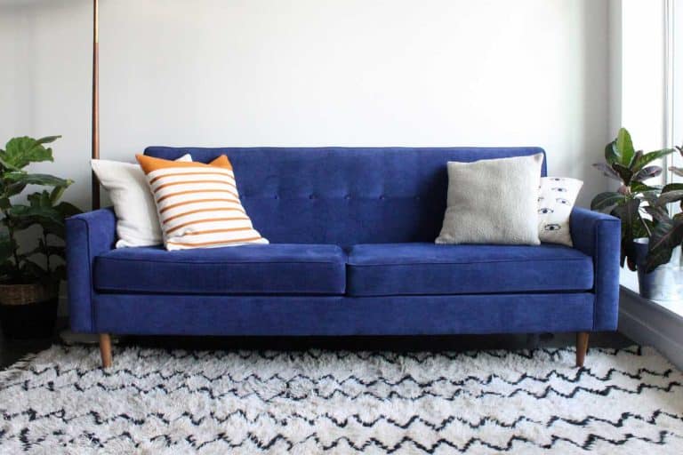 A royal blue suede mid century modern 4-seater couch, How Long Is A Couch [Standard Couch Sizes]