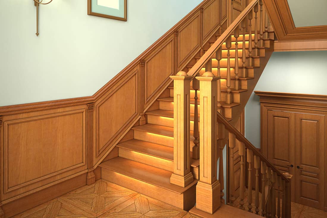 Wooden staircase with a wooden stair railing, How to Paint or Restain Stair Railings