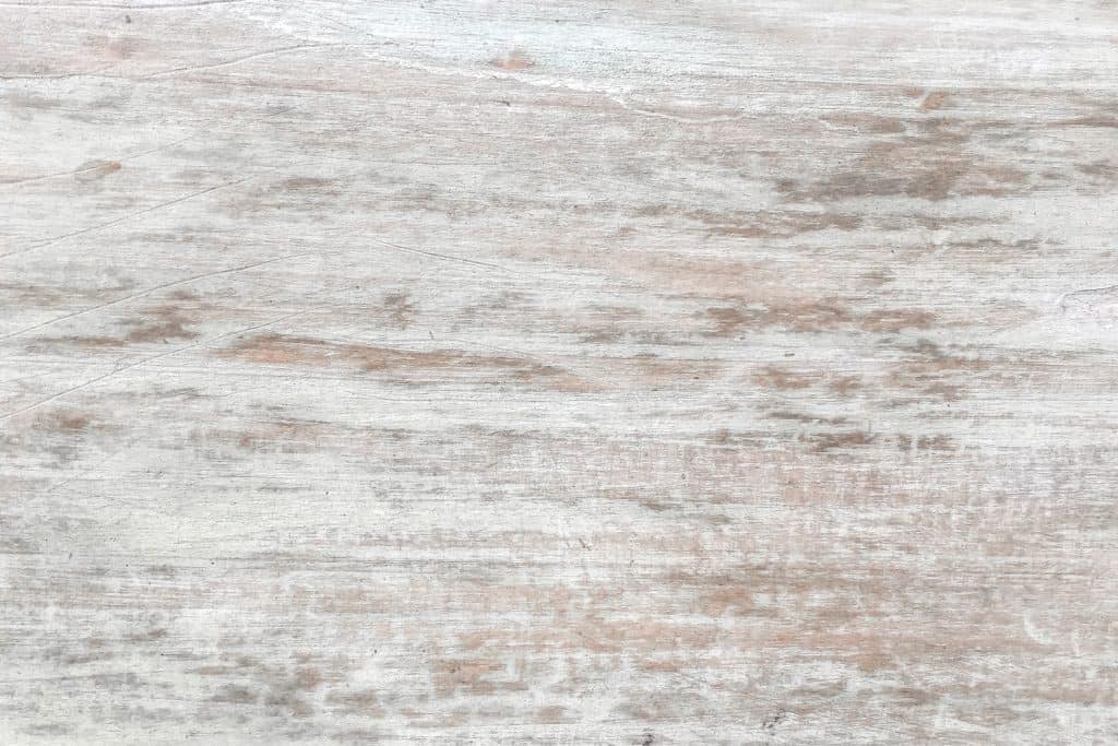 An up close photo of whitewashed timber