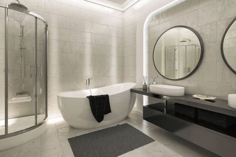 Bathroom with a double round mirror on the vanity area, semi-circular shower area and a white bathtub, 25 Grey and White Bathrooms