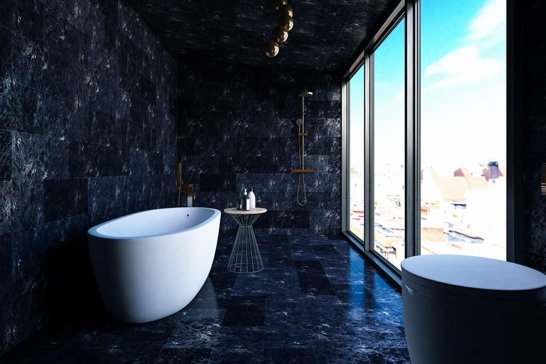 A bathroom with dark marble walls, ceiling and flooring with a huge glass window on the side, How To Clean Marble Floor In Bathroom [4 Steps]