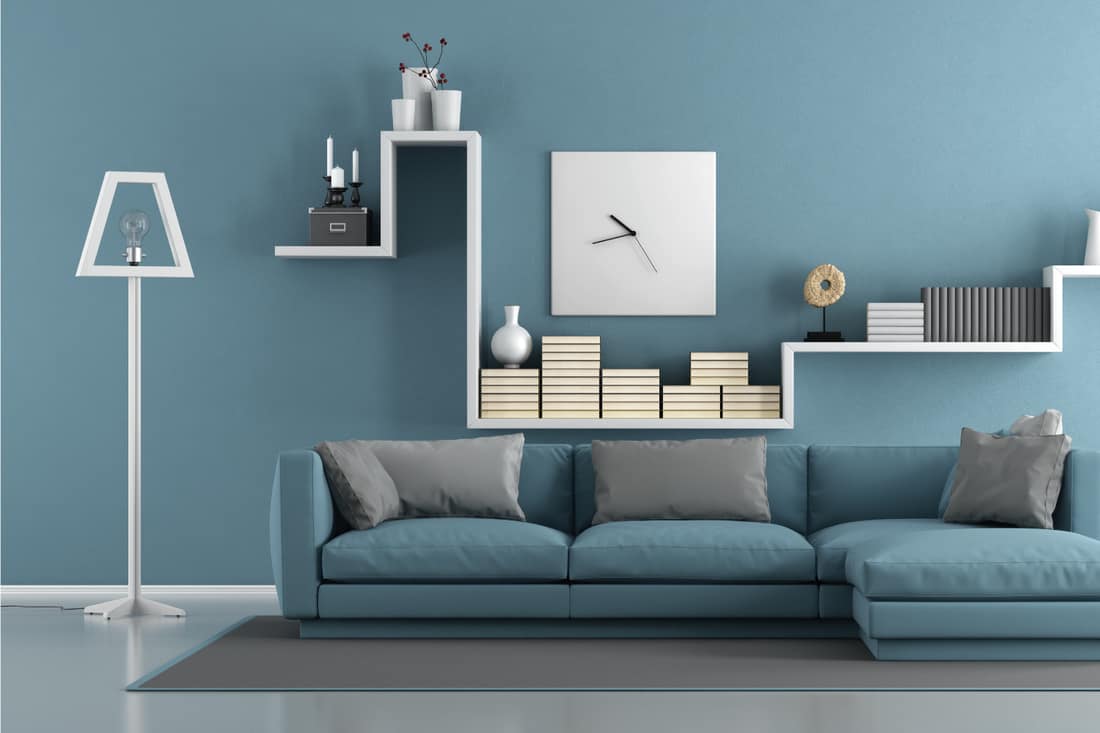 Blue living room with sofa and shelf