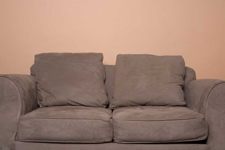 Brown microfiber couch in an orange room, How to Clean Microfiber Couch [4 Effective Ways]