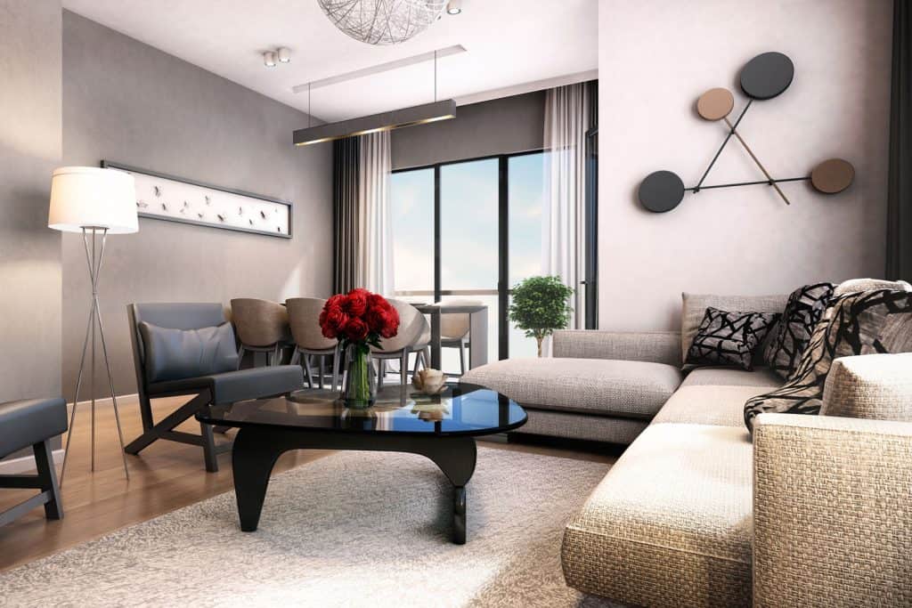 Contemporary living room with modern designed furnitures, a beige sectional couch, and a gray couch