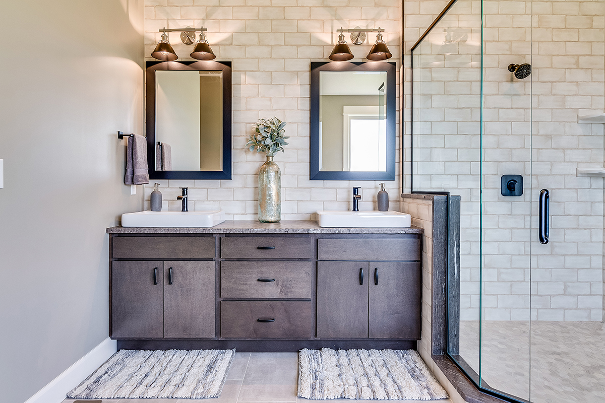Gorgeous double mirrors and subway tile wall in the bathroom