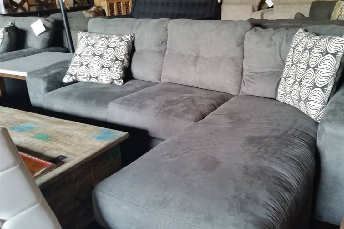 Gray silver sectional sofa with chaise furniture with accent pillows, Where To Place A Sectional In Your Living Room (Inc. Should It Be Against A Wall)?