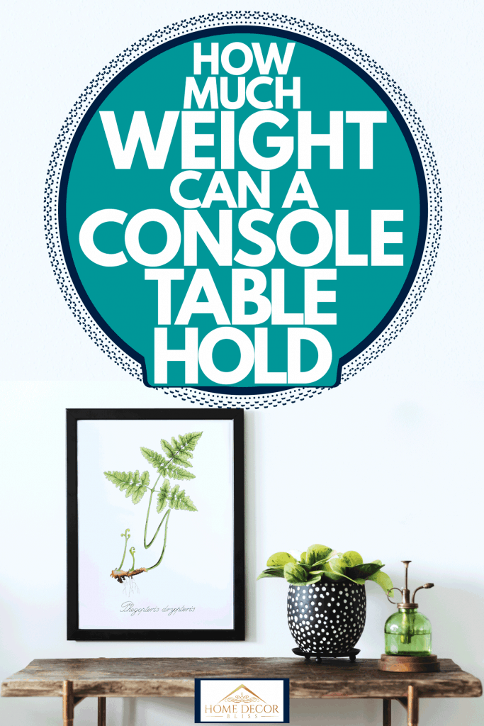 A wooden console table with metal chairs, a black framed picture frame and an indoor plant on the side, How Much Weight Can A Console Table Hold