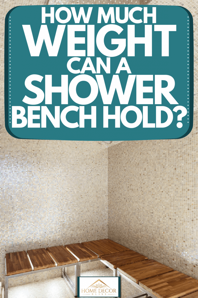 A decorative tiled bathroom with a wooden bench and metal frames, How Much Weight Can A Shower Bench Hold?