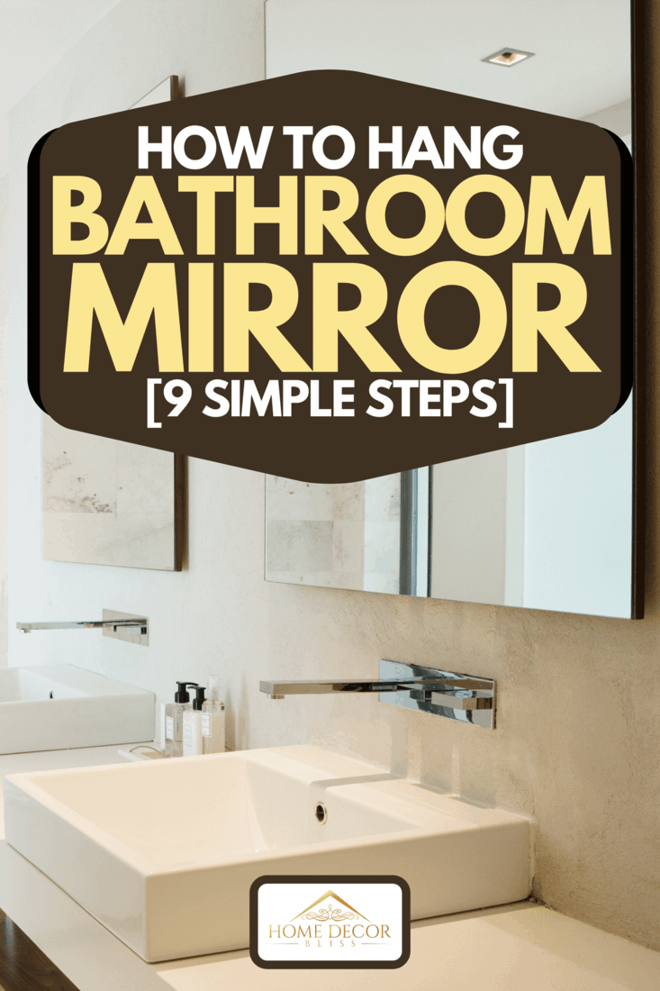 A modern bathroom vanity and bathtub, How to Hang Bathroom Mirror [9 Simple Steps]