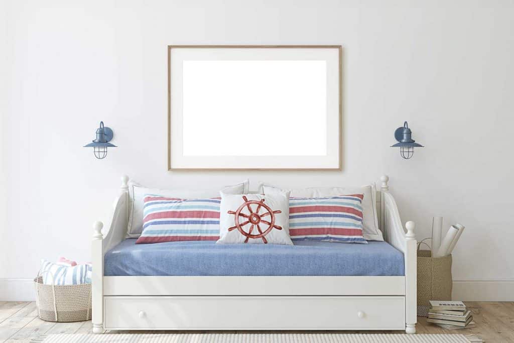 Kids room in coastal style with daybed and wooden frame on the wall