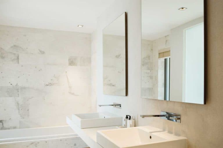 Modern bathroom vanity and bathtub, How to Hang Bathroom Mirror [9 Simple Steps]