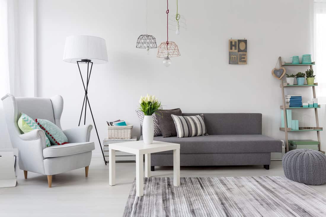 Modern living room interior with a grey armchair