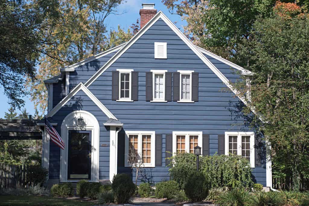 Pre colonial house with blue painted wooden sidings