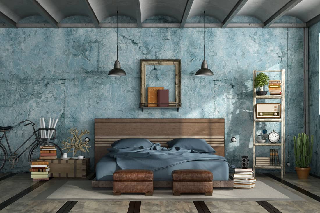Rustic blue themed bedroom with a wooden flat bed and blue beddings 