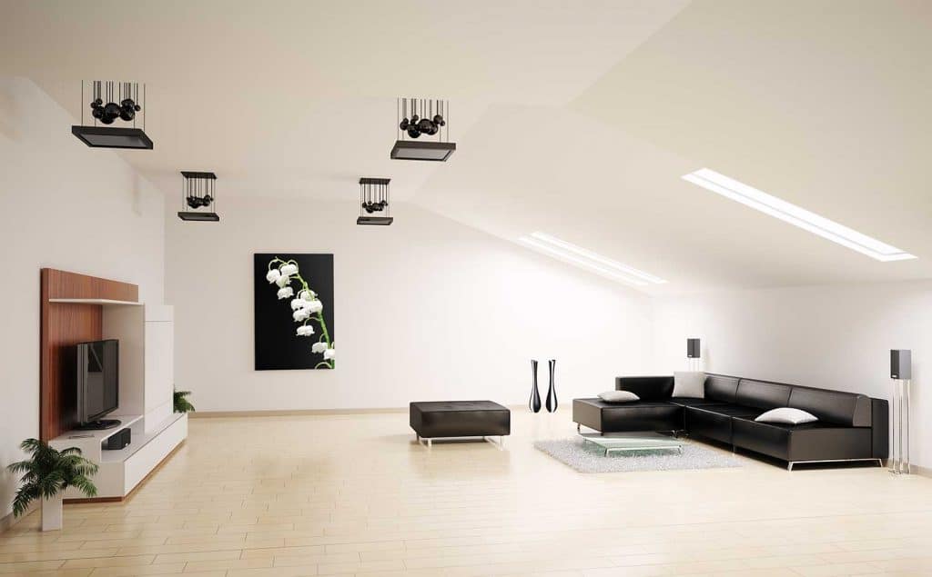 Spacious living room interior with black leather corner sofa