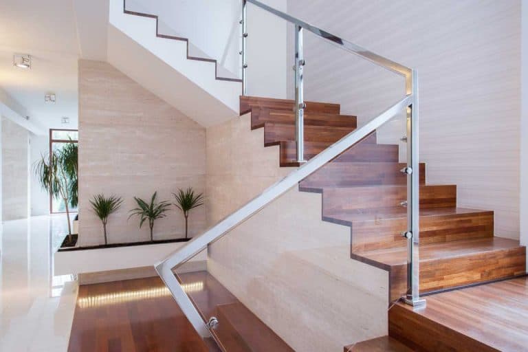 Stylish staircase with glass stair railings in bright interior, 15 Awesome Stair Banisters And Railings Ideas
