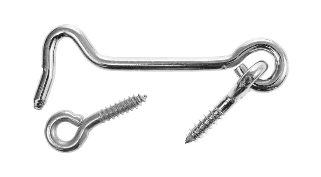 Top view of a stainless steel gate hook with screw eye isolated on a white background