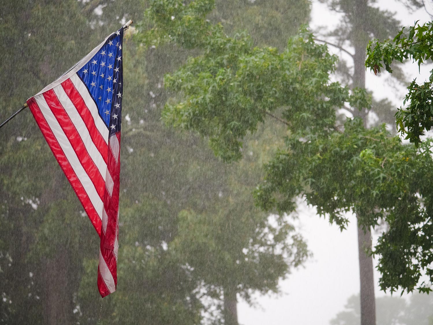 United States flag in rain storm