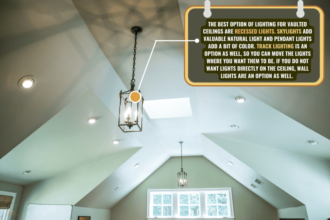 Vaulted ceiling with a modern Gothic mid evil iron metal hanging lights and a green walls. - What Is The Best Lighting For Vaulted Ceilings