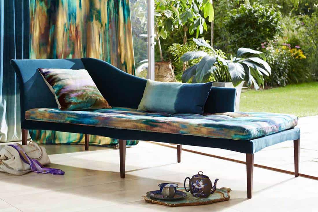 Vibrant daybed with cushions in modern home, How To Make A Daybed Look Like A Couch [6 EASY Ideas]