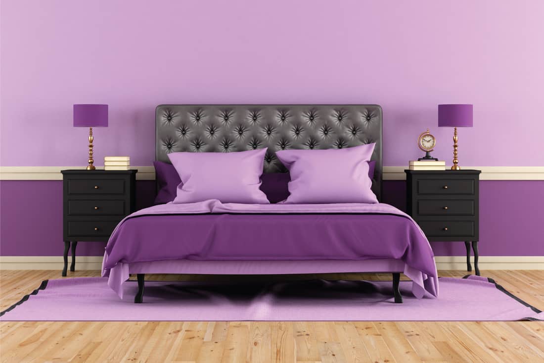Classic bedroom in purple and violet with black bedside tables