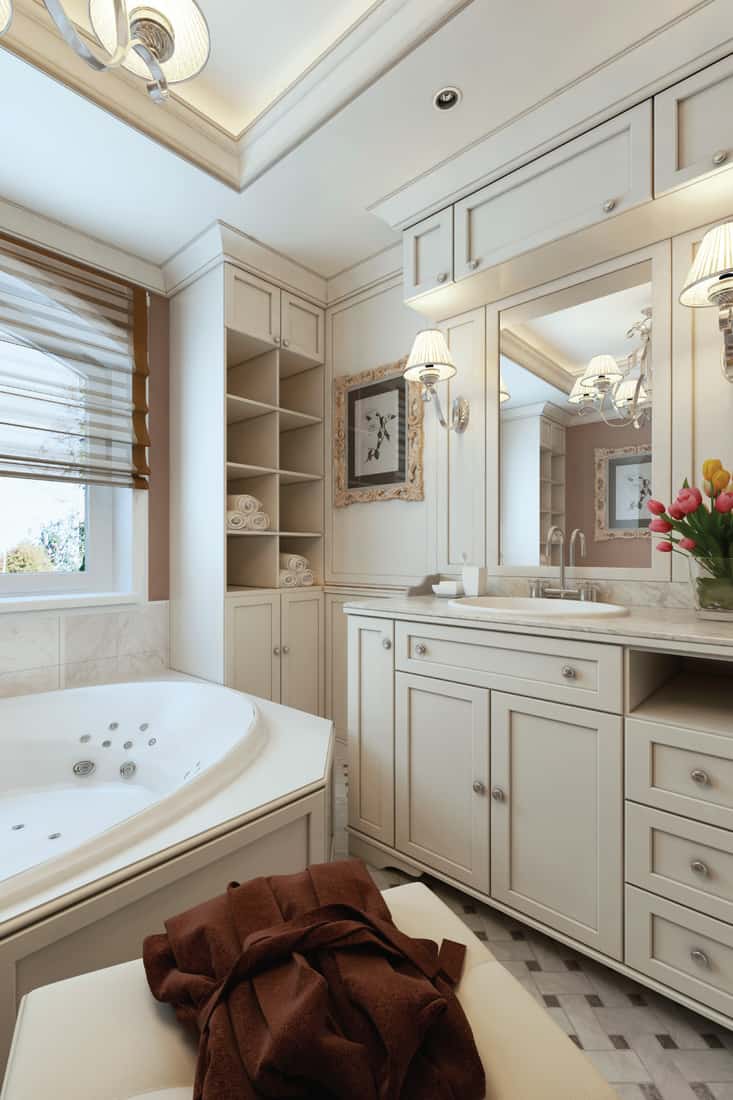 Elegant bathroom with large vanity mirror and tub