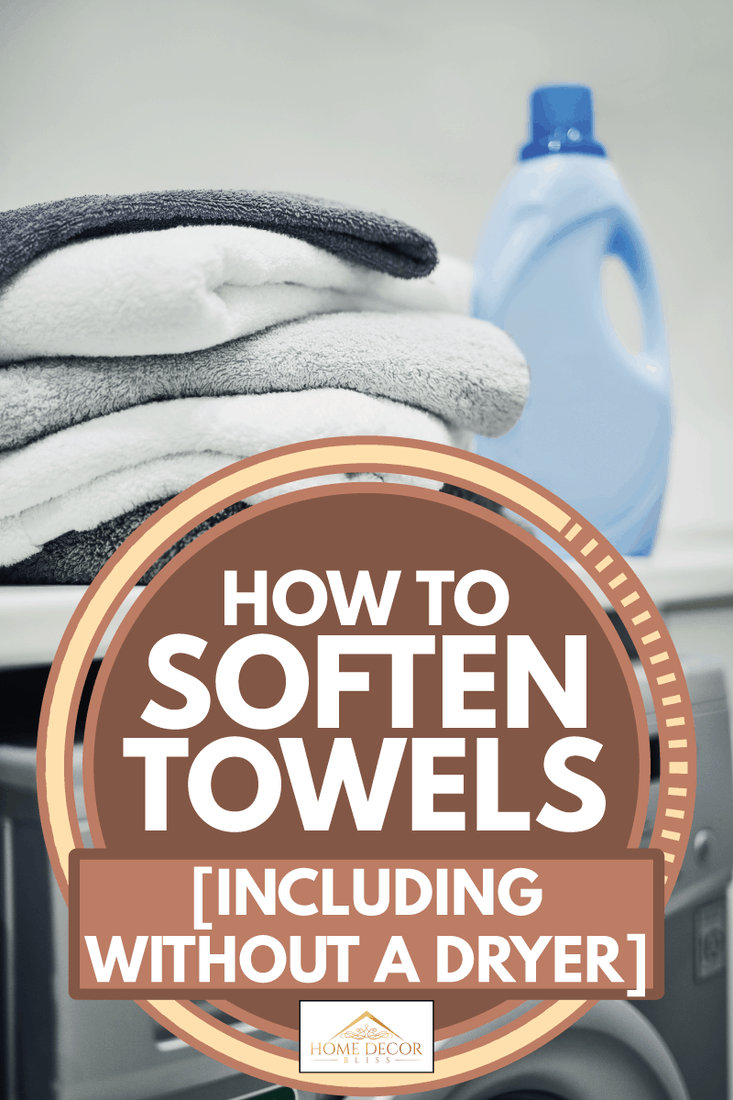 fresh soft towels on top of a home laundry machine, How To Soften Towels (Including Without A Dryer)