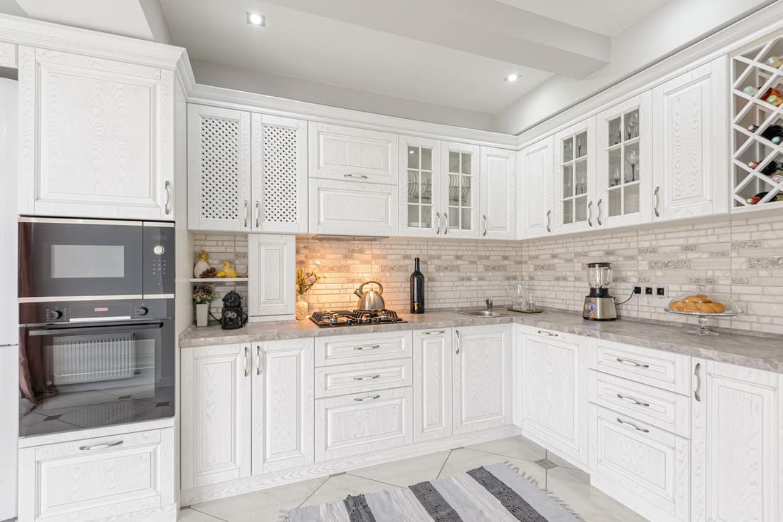 interior of modern white wooden kitchen in luxury home 
